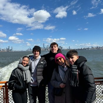Family holiday to New york. Ferry with skyline in the background Family holiday to New york. Ferry with skyline in the background